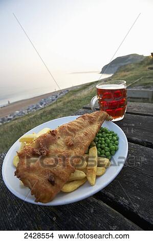 Fish and chips in a pub on the Dorset coast in a sea town; Dorset, England View Large Photo Image Picture - Fish and chips in a pub on the Dorset coast in a sea town; Dorset, England. Fotosearch