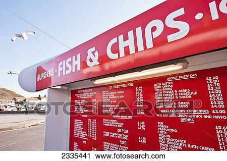 Stock Image - Fish And Chips Kiosk Menu; West Bay, Jurassic Coast, Dorset, England. Fotosearch