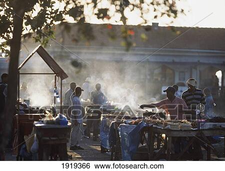Fish And Meat Barbeques At Dusk View Large Photo Image Stock Photograph - Fish And Meat Barbeques At Dusk. Fotosearch