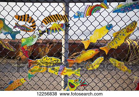 Stock Photo - Fish detail on fence along boardwalk; New Westminster, British Columbia, Canada. Fotosearch