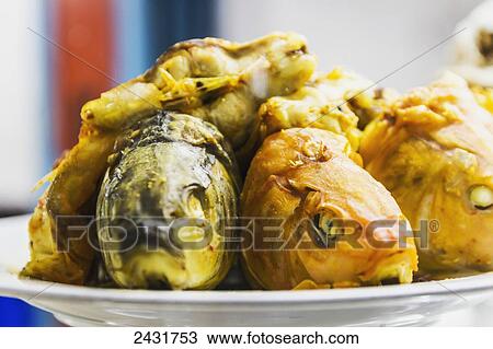 Stock Image - Fish in glass display case of a restaurant, Parapat, Lake Toba, North Sumatra, Indonesia. Fotosearch