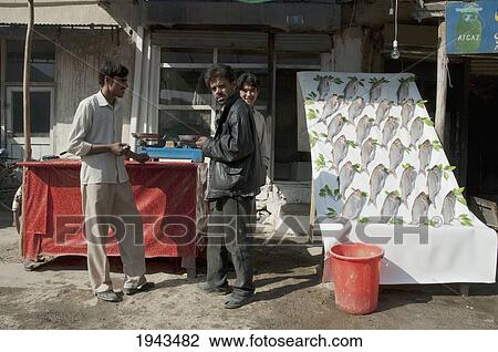 Stock Image - Fish Vendor In Kabul,, Afghanistan. Fotosearch