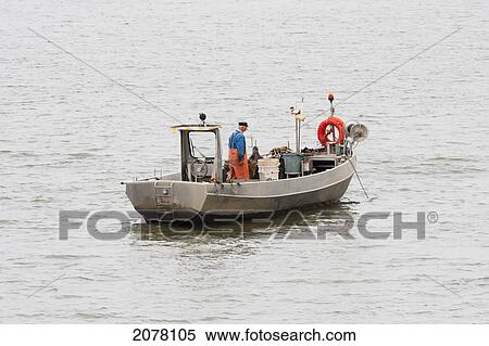 Fisherman In His Trawler, Rotterdam, Netherlands View Large Photo Image Stock Photography - Fisherman In His Trawler, Rotterdam, Netherlands. Fotosearch