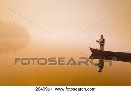 Fisherman In Mist At Sunrise, Rimouski Lake, Rimouski Wildlife Reserve, Bas-Saint-Laurent Region, Quebec View Large Photo Image Stock Photo - Fisherman In Mist At Sunrise, Rimouski Lake, Rimouski Wildlife Reserve, Bas-Saint-Laurent Region, Quebec. Fotosearch