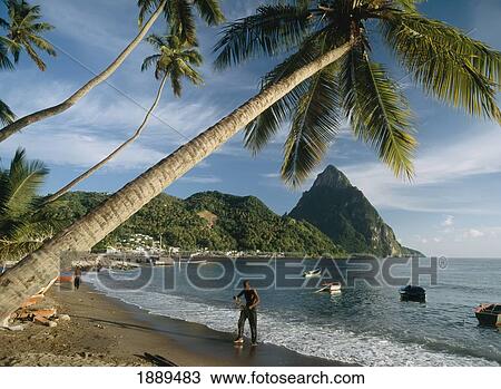 Stock Image - Fisherman On Beach. Fotosearch