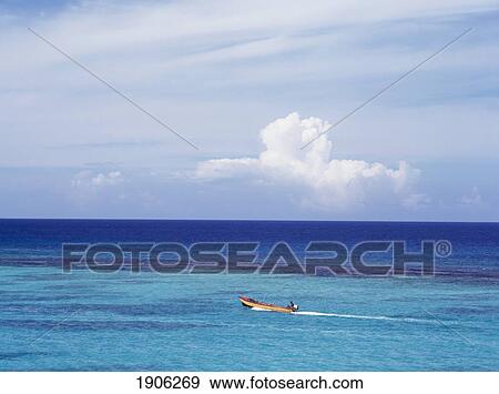 Stock Photo - Fisherman On Boat Off The North Coast Ocho Rios, Jamaica. Fotosearch