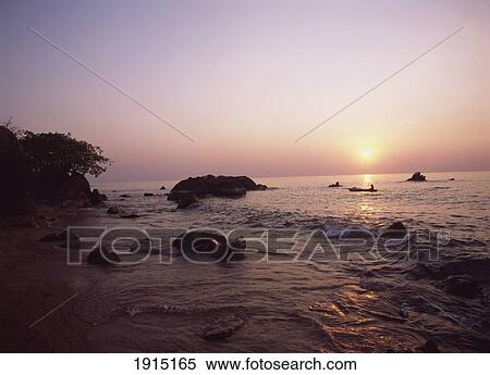 Fisherman Paddling Past Beach At Usisya View Large Photo Image Stock Photography - Fisherman Paddling Past Beach At Usisya. Fotosearch