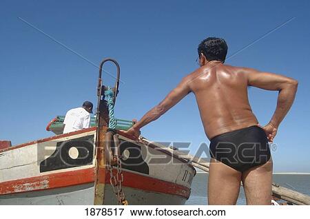 Fisherman Standing By Boat View Large Photo Image Stock Photo - Fisherman Standing By Boat. Fotosearch