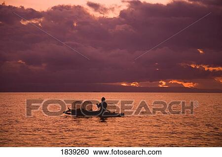 Fisherman With Baskets On Sea At Sunset; Dumaguete, Oriental s Island, Philippines View Large Photo Image Stock Image - Fisherman With Baskets On Sea At Sunset; Dumaguete, Oriental s Island, Philippines. Fotosearch