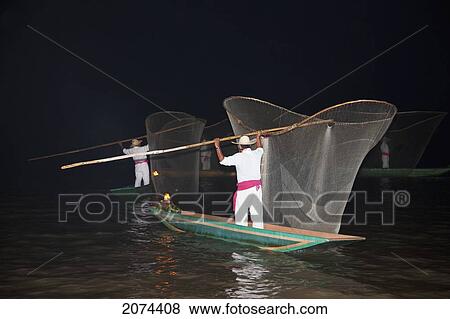 Stock Photo - Fisherman With Butterfly Nets In Lake P. Fotosearch