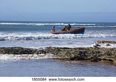 Picture - Fishermen At Sidi Kaouki Beach, Essaouira, Morocco. Fotosearch