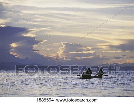 Picture - Fishermen Going Past The Island Of Domwe At Dusk. Fotosearch