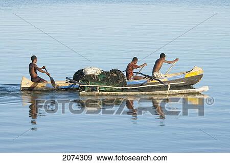 Fishermen In A Boat On The Mozambique Channel, Mangily, Toliara Province, Madagascar View Large Photo Image Stock Photo - Fishermen In A Boat On The Mozambique Channel, Mangily, Toliara Province, Madagascar. Fotosearch