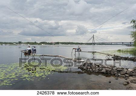 Stock Photo - Fishermen in Dneiper river; Kiev, Ukraine. Fotosearch