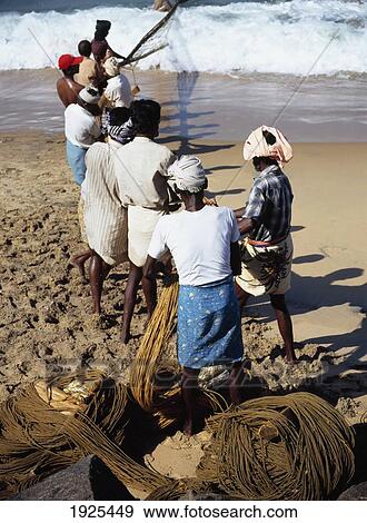 Stock Photo - Fishermen On Beach Near Kovalam. Fotosearch