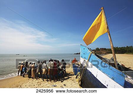 Stock Photograph - Fishermen on Bekal beach; Northern Kerala, India. Fotosearch