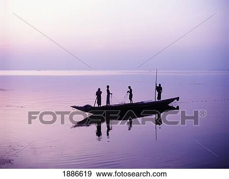 Stock Photo - Fishermen On Chilka Lake At Dawn. Fotosearch