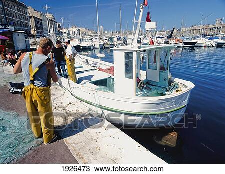 Fishermen Sorting Out Fishing Nets View Large Photo Image Stock Image - Fishermen Sorting Out Fishing Nets. Fotosearch