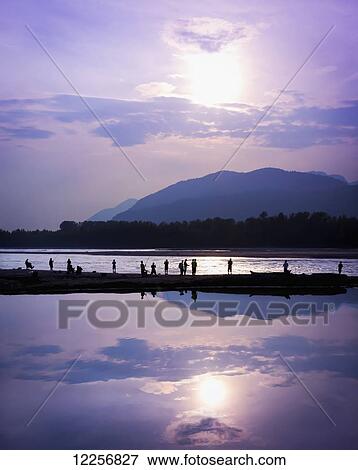 Fishing at sunset on the Peg Leg Bar; Chilliwack, British Columbia, Canada View Large Photo Image Stock Photo - Fishing at sunset on the Peg Leg Bar; Chilliwack, British Columbia, Canada. Fotosearch