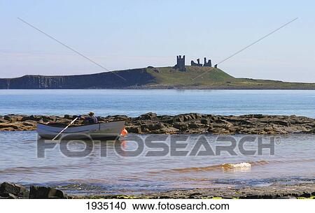 Fishing Boat And Dunstanburgh Castle; Northumberland, England View Large Photo Image Stock Image - Fishing Boat And Dunstanburgh Castle; Northumberland, England. Fotosearch