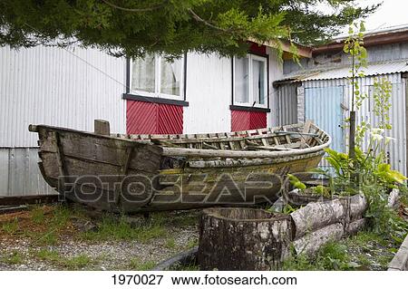Fishing Boat By A House, Puerto Aguirre, Aysen Region, Chile View Large Photo Image Stock Photo - Fishing Boat By A House, Puerto Aguirre, Aysen Region, Chile. Fotosearch