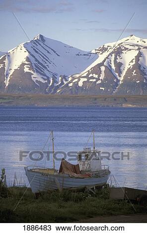 Fishing Boat By Lake And Snowcapped Mountains View Large Photo Image Stock Image - Fishing Boat By Lake And Snowcapped Mountains. Fotosearch