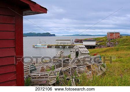 Stock Photograph - Fishing Boat Dock & Lobster Traps, Open Hall, Newfoundland. Fotosearch