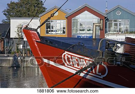 Fishing Boat In Harbor By Colorful Houses View Large Photo Image Stock Photograph - Fishing Boat In Harbor By Colorful Houses. Fotosearch