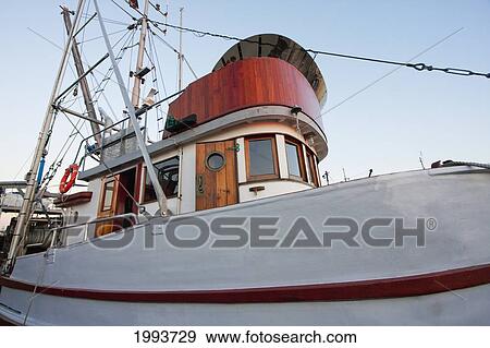 Fishing Boat In The South Arm Of The Fraser River By The Historic Fishing Village Of Steveston At Dusk, Richmond, British Columbia, Canada View Large Photo Image Stock Photo - Fishing Boat In The South Arm Of The Fraser River By The Historic Fishing Village Of Steveston At Dusk, Richmond, British Columbia, Canada. Fotosearch