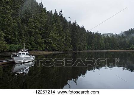 Fishing boat moored along shoreline; Queen Charlotte Islands, British Columbia, Canada View Large Photo Image Picture - Fishing boat moored along shoreline; Queen Charlotte Islands, British Columbia, Canada. Fotosearch
