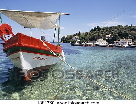 Stock Image - Fishing Boat Moored By Coastline. Fotosearch