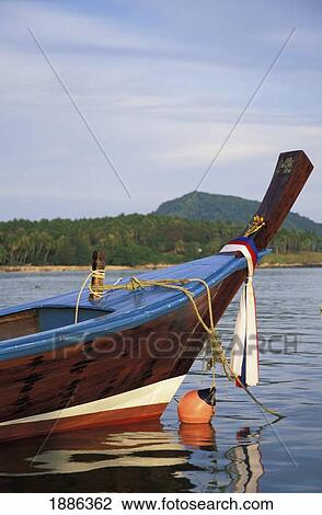 Stock Image - Fishing Boat Moored Off Rawai Beach. Fotosearch
