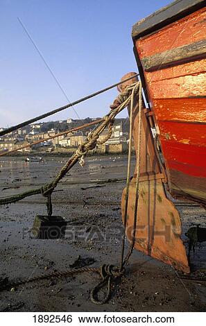 Stock Photograph - Fishing Boat Moored On Beach. Fotosearch