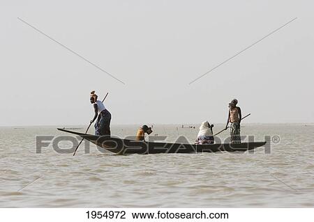 Fishing boat on Lake Debo, formed by the seasonal flooding of the Niger River, Mali View Large Photo Image Stock Image - Fishing boat on Lake Debo, formed by the seasonal flooding of the Niger River, Mali. Fotosearch