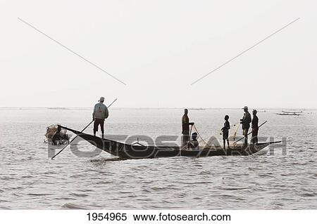 Stock Photography - Fishing boat on Lake Debo, formed by the seasonal flooding of the Niger River, Mali. Fotosearch