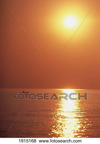 Stock Photo - Fishing Boat On Lake Malawion At Dawn. Fotosearch
