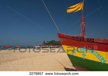 Fishing boat on the beach; Baga, Goa, India View Large Photo Image Stock Photo - Fishing boat on the beach; Baga, Goa, India. Fotosearch