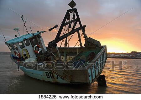 Fishing Boat On The Shore At Sunset View Large Photo Image Stock Photograph - Fishing Boat On The Shore At Sunset. Fotosearch