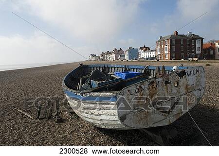 Stock Photo - Fishing Boat Pulled To Shore On Aldeburgh Beach, Suffolk, Uk. Fotosearch