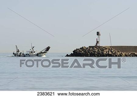 Fishing boat returning to the port; Porto San Giorgio, Marche, Italy View Large Photo Image Stock Image - Fishing boat returning to the port; Porto San Giorgio, Marche, Italy. Fotosearch