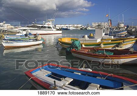 Stock Image - Fishing Boats And Yachts In Harbor. Fotosearch