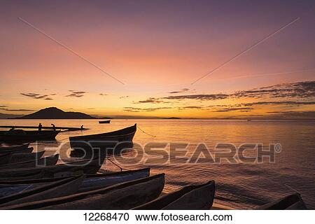 Fishing boats at dusk, Cape Maclear, Lake Malawi; Malawi View Large Photo Image Stock Image - Fishing boats at dusk, Cape Maclear, Lake Malawi; Malawi. Fotosearch