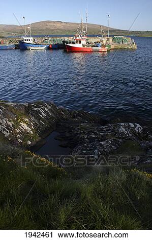 Stock Image - Fishing Boats At The Pier On The Sheep's Head Way; Ahakista County Cork Ireland. Fotosearch