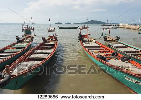 Fishing boats by the local pier; Kep, Cambodia View Large Photo Image Stock Photograph - Fishing boats by the local pier; Kep, Cambodia. Fotosearch