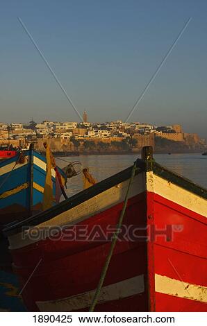 Stock Photography - Fishing Boats In Front Of Kasbah Des Oudaias. Fotosearch