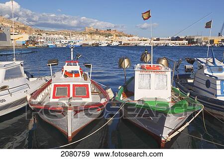 Stock Photo - Fishing Boats In The Harbour And The Moorish Alcazaba Or Castle In Background; Almeria Almeria Province Spain. Fotosearch