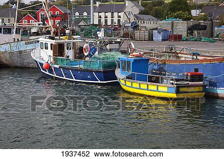 Stock Image - Fishing Boats Moored In Dingle Harbor; Dingle County Kerry Ireland. Fotosearch