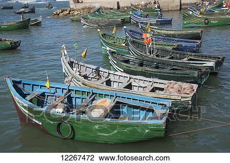 Fishing boats moored in the harbour; Souira Kedima, Safi, Morocco View Large Photo Image Stock Image - Fishing boats moored in the harbour; Souira Kedima, Safi, Morocco. Fotosearch