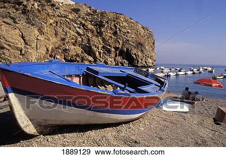 Fishing Boats On Beach By Cliff View Large Photo Image Stock Photo - Fishing Boats On Beach By Cliff. Fotosearch