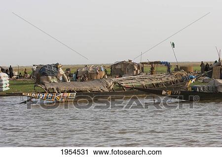 Fishing boats on Lake Debo, formed by the seasonal flooding of the Niger River, Mali View Large Photo Image Stock Image - Fishing boats on Lake Debo, formed by the seasonal flooding of the Niger River, Mali. Fotosearch